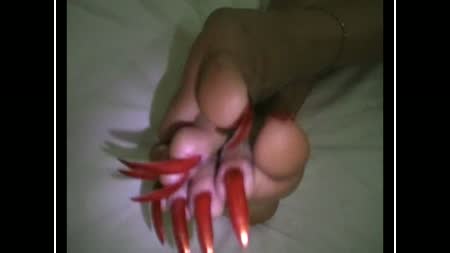 Sexy Orange Claws Showing - Goddess cath to show sexy claws..She have long sharp fingernail and toenail..She polished by orange color..High quality with screen size is 1280x720 for better download..